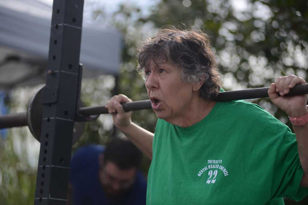 Carol Thompson prepares to do a squat on Friday, Sep. 13, 2019 at Logboat Brewing Co. for Share the Load of Mental Health